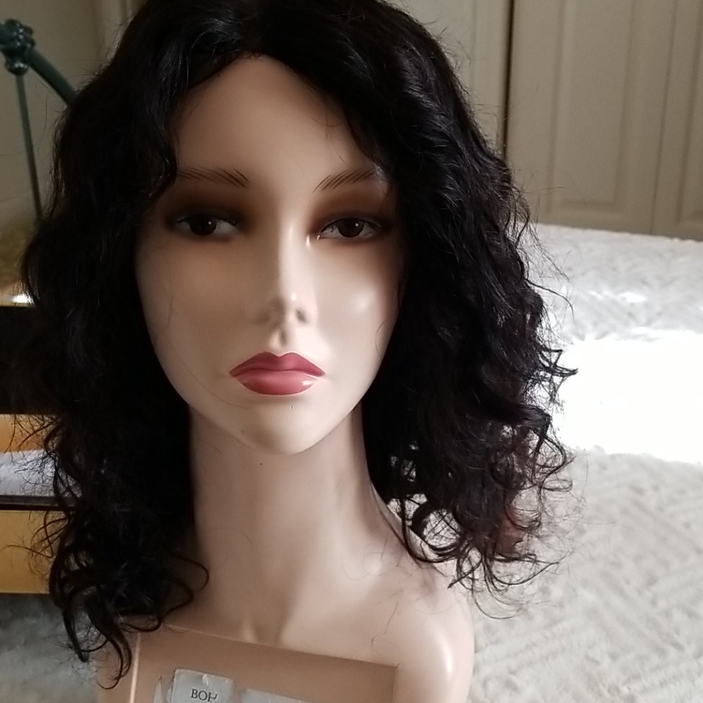 This wig is beautiful. Worn once but too large for my head... Brazilian Lace wig